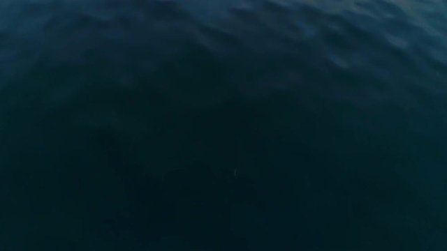 Drone Travelling over the Hoddevik Sea with a Glimpse of the Sunset
