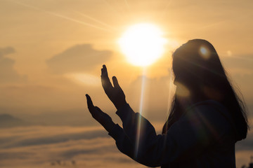A beautiful girl raised her hand to pray. And promised myself. And the sun goes down. God bless you...