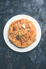 Aloo Paratha / Indian Potato stuffed Flatbread. Served with fresh curd and tomato ketchup. selective focus