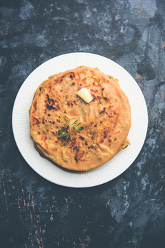 Aloo Paratha / Indian Potato stuffed Flatbread. Served with fresh curd and tomato ketchup. selective focus