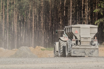 TRACTOR WITH A TRAILER - The vehicle on construction site © Wojciech Wrzesień
