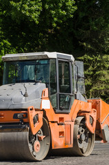 ROAD ROLLER - Construction machine is standing on the road © Wojciech Wrzesień