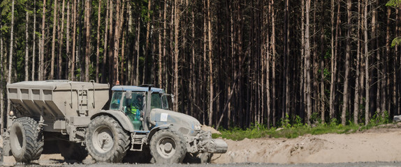 TRACTOR WITH A TRAILER - The vehicle on construction site © Wojciech Wrzesień