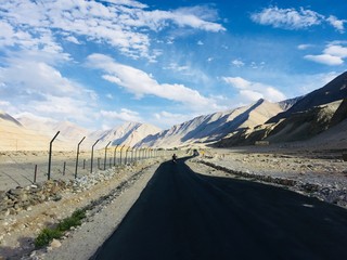 Long road along the mountains.