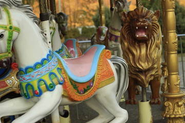 Fototapeta na wymiar carousel, horse, ride, fair, fun, carnival, park, amusement, merry-go-round, horses, colorful, merry, round, merry go round, statue, fairground, childhood, funfair, temple