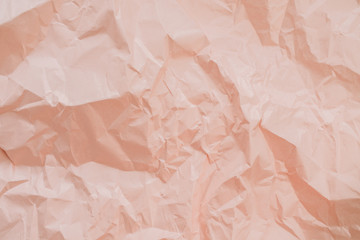 Colorful peachy crumpled paper texture.