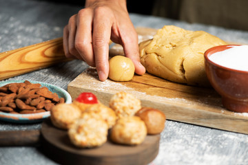 man preparing panellets, typical of Catalonia