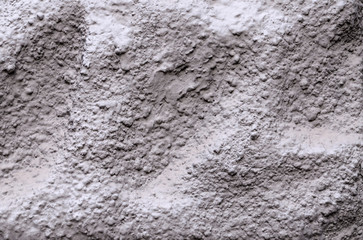 Grey cement wall background surface, hilly texture