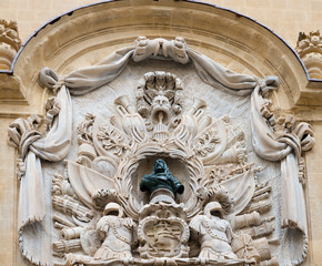 Centerpiece With Trophy Of Arms And Bust Of Grand Master Gregorio Carafa From The Facade Of The Auberge D'Italie In Merchants Street, Valletta, Malta