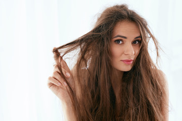 Hair Problem. Woman With Dry And Damaged Long Hair