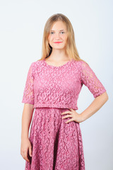 smiling girl teenager model in pink dress