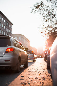 road and buildings at city with sunset