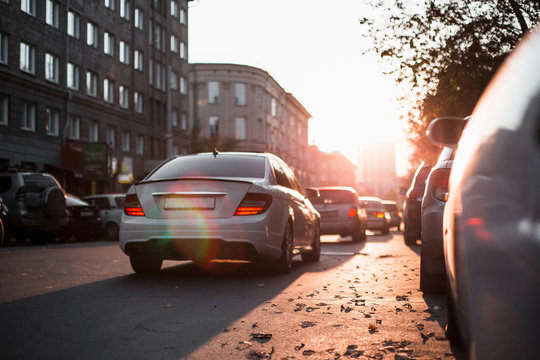 road and buildings at city with sunset