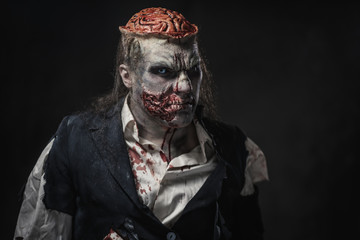 Scary zombie prostheric makeup on male model © Nejron Photo
