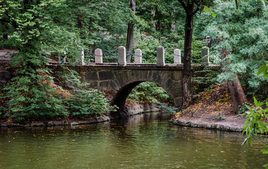 Fototapeta na wymiar stone bridge on the river in autumn