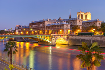 Night view of Ile de la Cite and Pont Notre-Dame in Paris, France