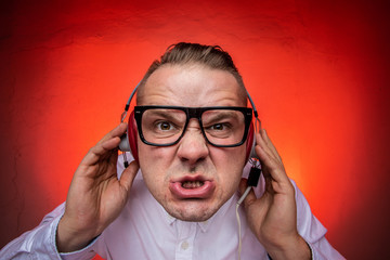 Man enjoys loud music in the headphones.