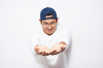 Happy Young Man Showing Something on His Empty Hands