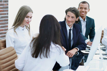 handshake business women with business partner at the negotiating table