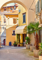 Lovran, Croatia. Cosy streets of ancient old town with arc.