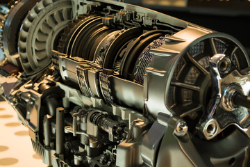  External and internal view of the engine of the car. Metal. Details and gears.