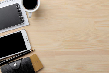 The concept of online shopping. Composition with discount cards phone and notebooks on the background of the table