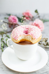 Cup with cappuccino, delicious doughnut, morning concept, bakery, fast carbs