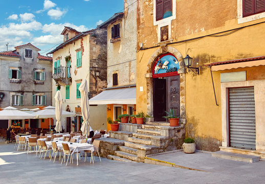 Fototapeta Lovran, Croatia. Central area of ancient old town with vintage