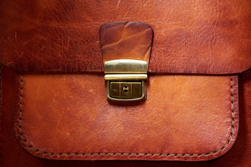 leather bag with a metal clasp
