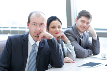 close up.business team sitting at their Desk