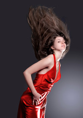 Fototapeta premium portrait of beautiful young woman on black background