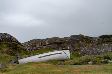 Abandoned boat on foggy morning