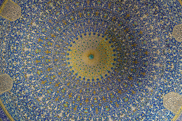 Breathtaking ceiling decorated with colorful tiles in interior of Imam Mosque at Naghsh-e Jahan Square