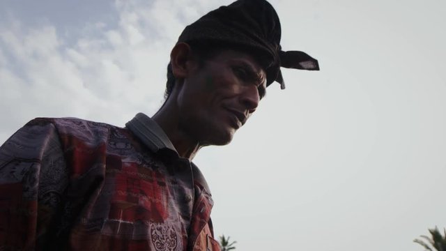 Close up of olive skinned man smoking cigarette