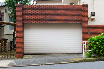 A closeup shot of automatic metal roller door used in factory, storage, garage, and industrial...