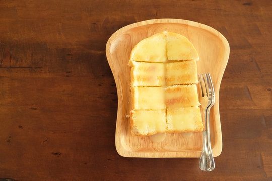 Butter and Sugar Toast. Close-up bread toast with butter and condensed milk in plate