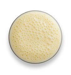 Glass of Vanilla  Milkshake with frothy bubbles