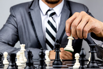 businessman playing chess board