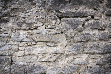 Beautiful texture of a gray stone wall. Backgrounds