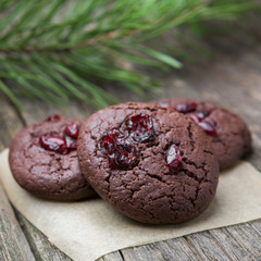 Hommede freshly baked chocolate cookies on wooden background