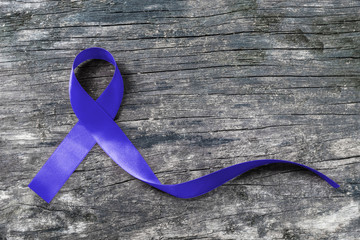 Colorectal/ Colon cancer, Cri du Chat and Acute Respiratory Distress Syndrome (ARDS) awareness with dark blue ribbon on old aged wood