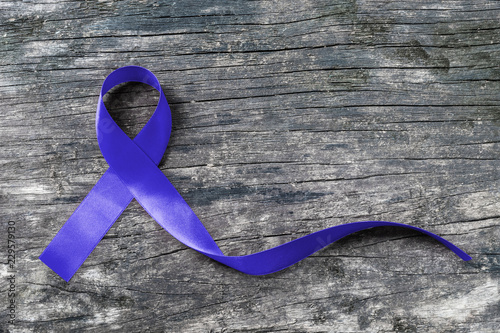 Colorectal/ Colon cancer, Cri du Chat and Acute Respiratory Distress Syndrome (ARDS) awareness with dark blue ribbon on old aged wood
