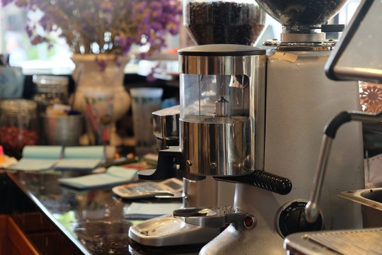 Coffee beans in the coffee machine. Coffee beans in the coffee grinder