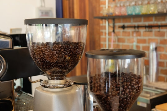 Coffee beans in the coffee machine. Coffee beans in the coffee grinder