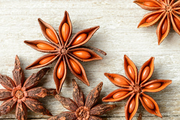 star anise fruits on the wooden board, top view