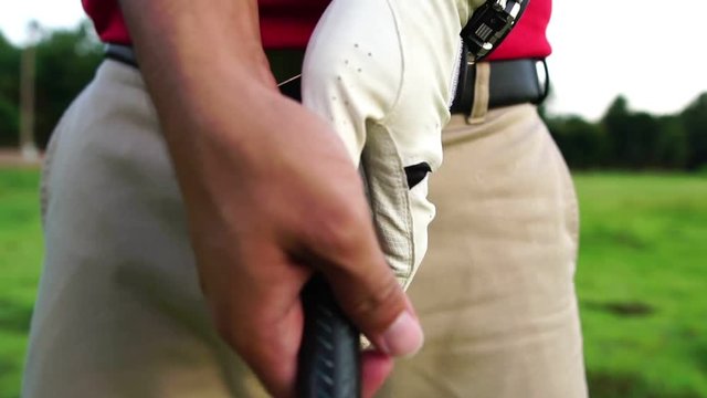 Golfers are holding golf clubs footage slow motion