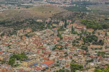 Fototapeta premium city view buildings and landmarks from above in aerial shot to red and orange roofs oh houses in one of south countries