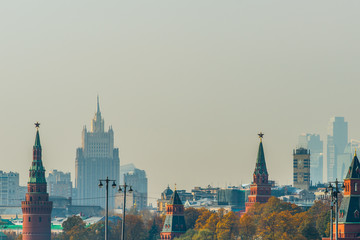 Fototapeta na wymiar Moscow Kremlin towers, city on a smoggy autumn day
