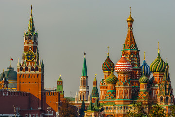 Fototapeta na wymiar Spasskaya tower of Moscow Kremlin and Saint Basil’s cathedral