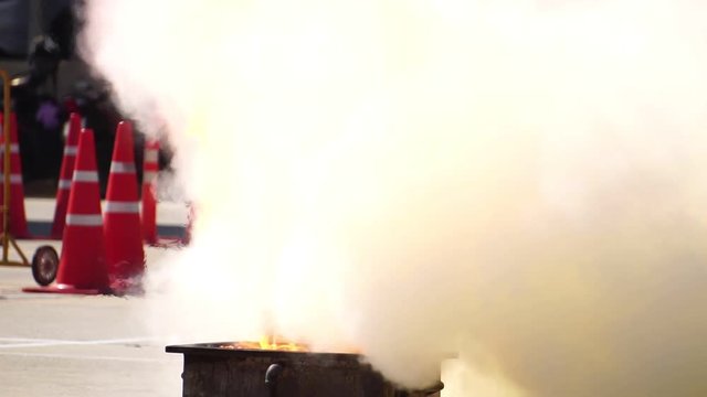 Chemical fire extinguisher fire burning in are severely footage slow motion